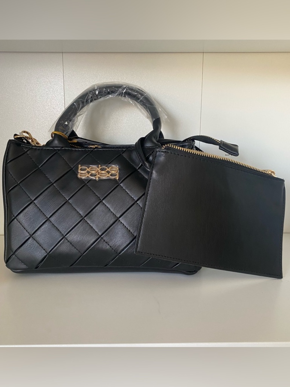 Bebe small black purse with cross body strap